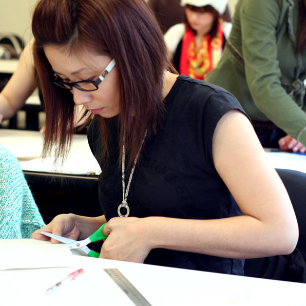 Fashion Design Students Cutting
