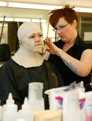 celine godeau applying makeup prosthetic