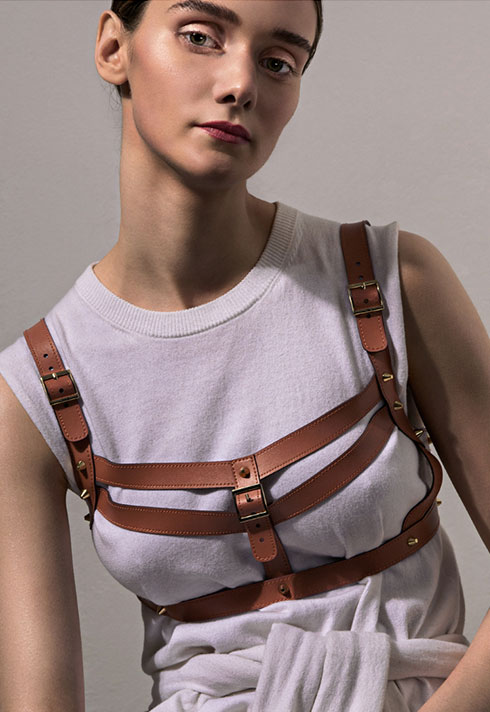 sarah danniels fashion marketing grad leather harness white tshirt