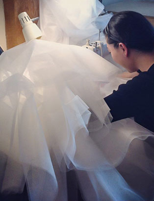 top fashion design graduate wen chee liu sewing skirt