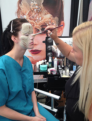 leanne podavin applying makeup effects at imats