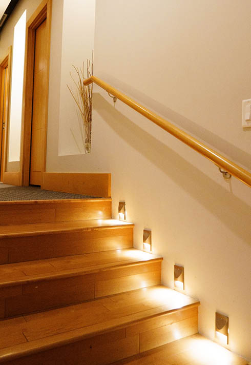 warm-toned wood stairs and bannister