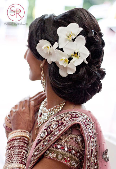 sharon rai bridal makeup pinned hair with orchids