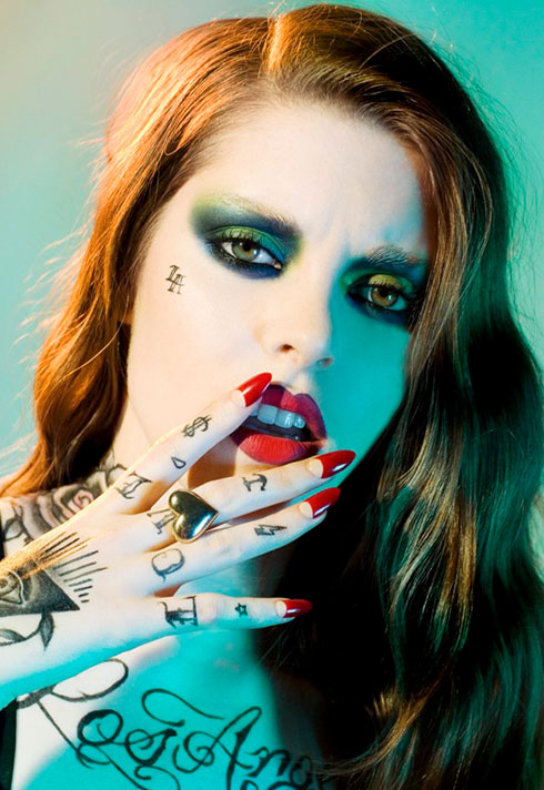 top makeup school graduate jenna kuchera red nails tattoos