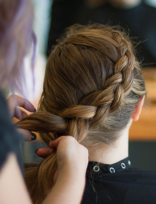 eliza trendiak salon owner braiding hair