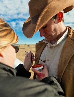 pepper gallegos applying makeup on actor jake burnham