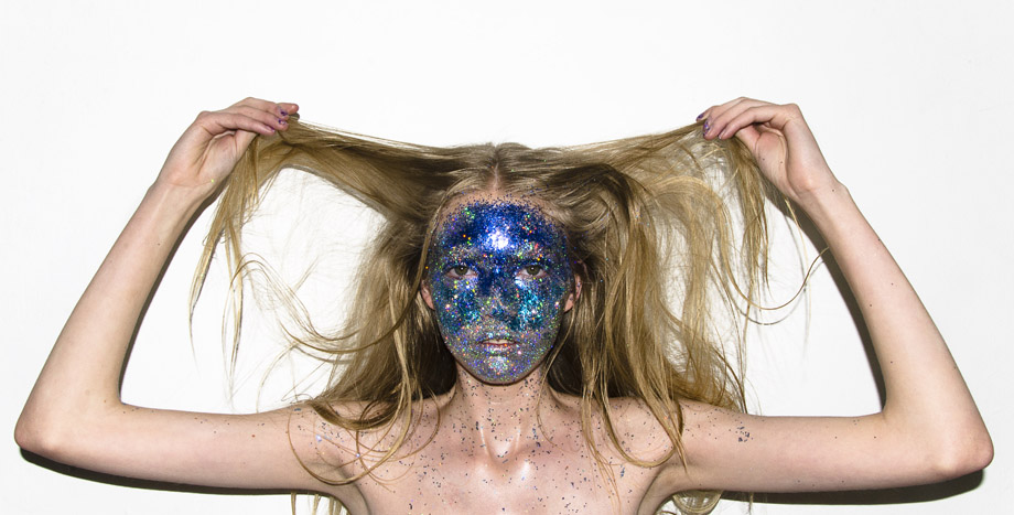 Freelance makeup artist, Ana V De G's makeup look with blue glitters all over the model's face