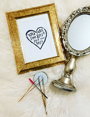 makeup tools from jojo esthetics with mirror and picture frame