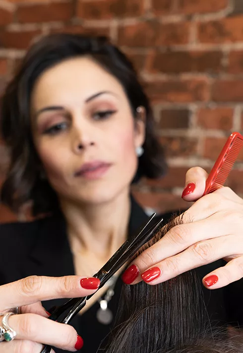 ana luisa valdez demonstrating hair cutting techniques at her studio in gastown pro hair school grad blanche macdonald centre