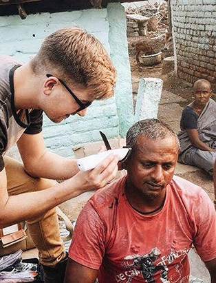 cody dunbar banche hair program graduate cutting hair in india