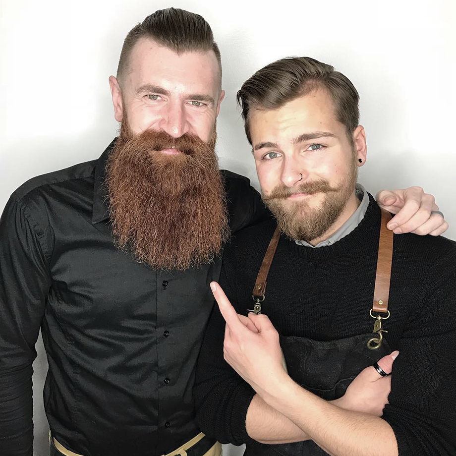 Barber and hairstylist and BMC graduate Cody Dunbar with a client at Bourbon Barber Shop Saskatchewan Canada