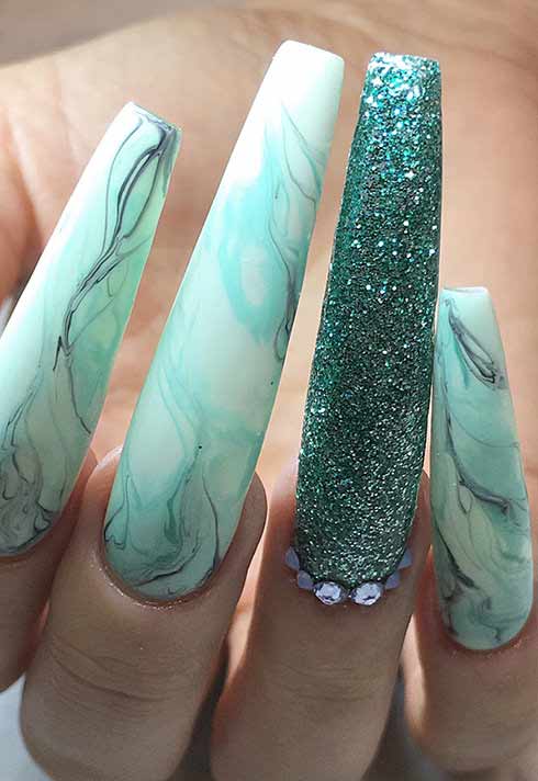 aqua and sparkle nails by BMC nail studio graduate Alejandra Ramazzini