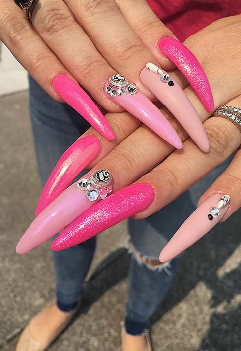 long neon pink nails with jewels by Blanche Macdonald Nail Studio graduate Alejandra Ramazzini