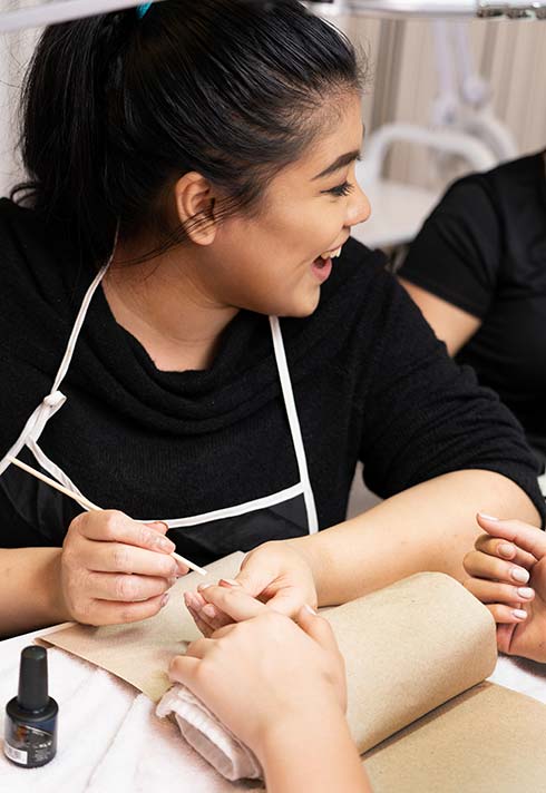 nail technician students having fun in blanche macdonald's nail studio classrooms