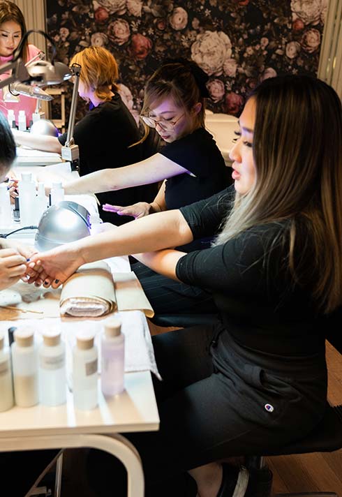 nail technician school students practicing nail design