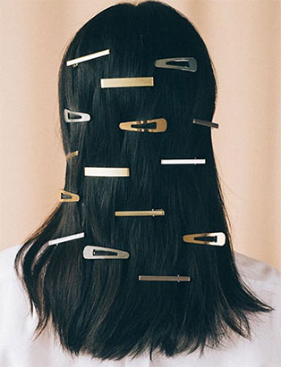 Blanche Macdonald hair program graduate Erin Klassen styles with hair clips