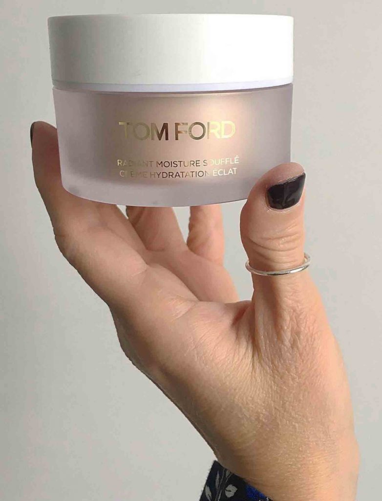 BMC makeup graduate Lori Woodhouse holding Tom Ford moisturizer