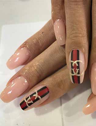 gucci branded nude nail design