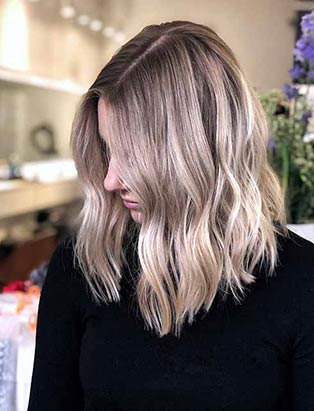 blonde wavy hair by Lara Dillman senior stylist at BLUSH Salon Vancouver and BMC graduate