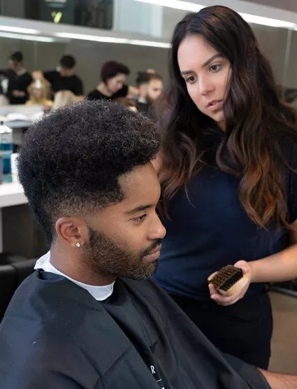 Blanche Macdonald Pro Hair Grad Sandra Perovic demos barbering techniques.