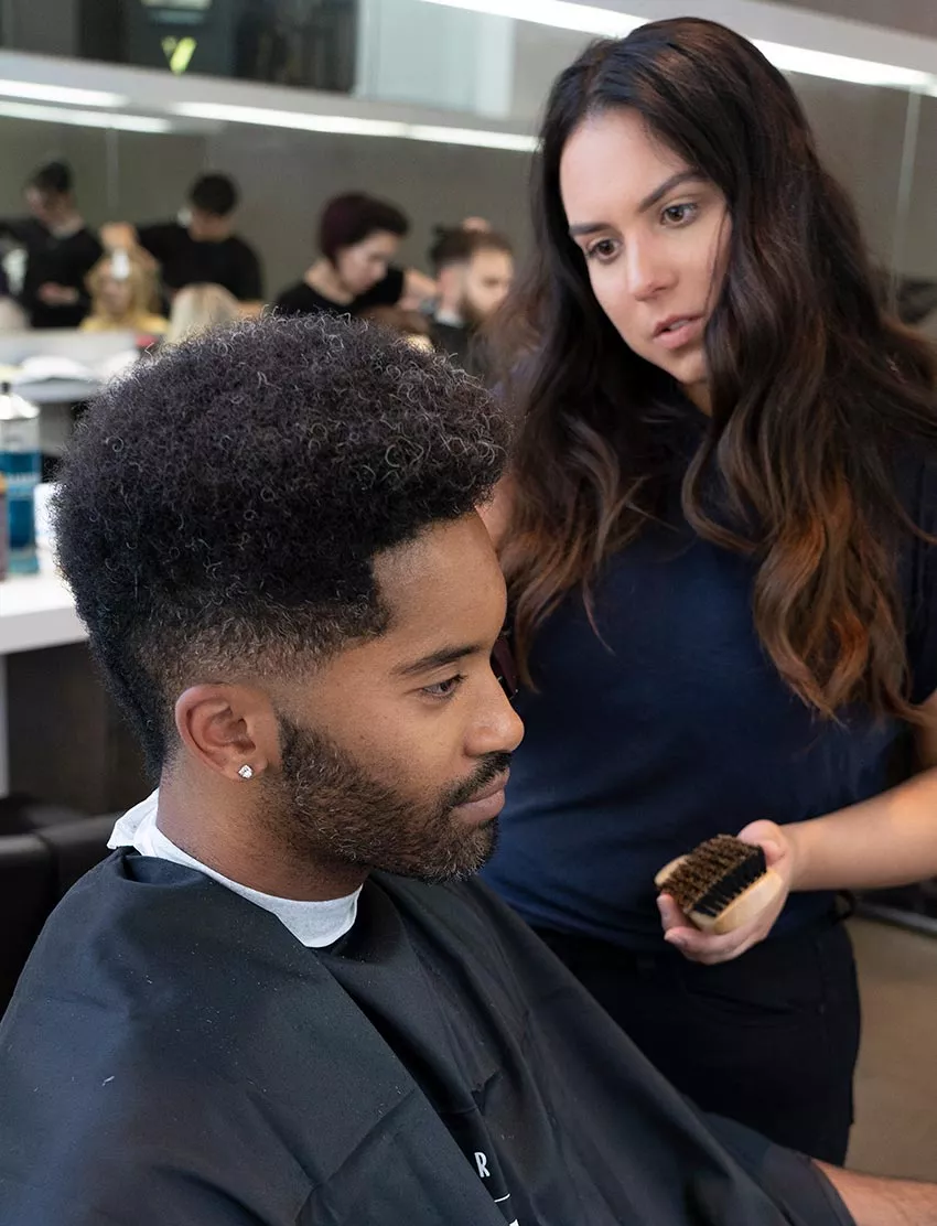 Blanche Macdonald Pro Hair Grad and Instructor Sandra Perovic demos barbering techniques.