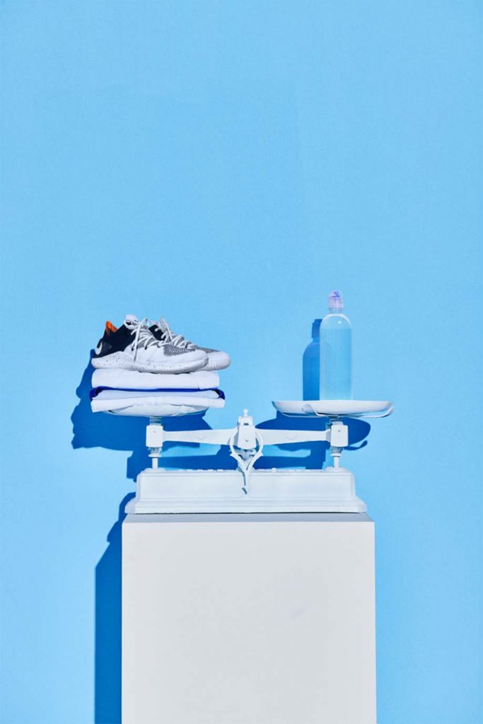 NIKE Sneakers and Waterbottle on a scale