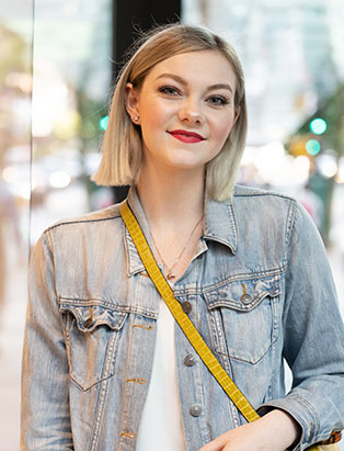 Blanche grad Emily Buhr portrait in front of Chanel Store