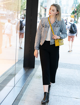 Blanche grad Emily Buhr walking by Vancouver Chanel Store