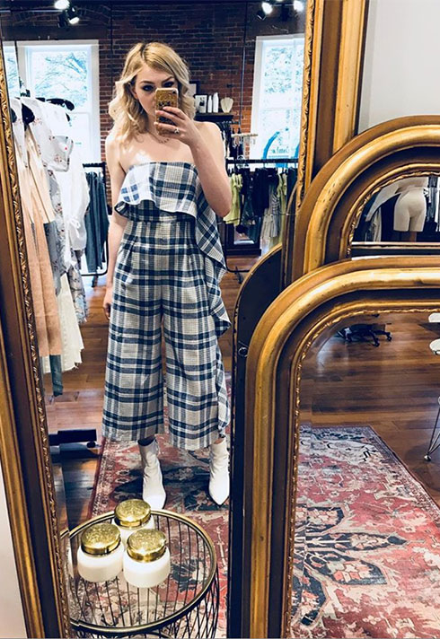 selfie wearing fashionable plaid jumpsuit and white boots