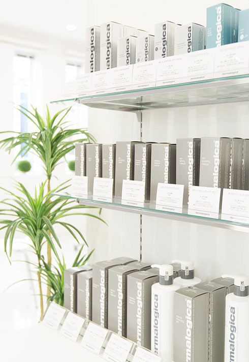 Shelves featuring Dermologica products in Tomoko Tajima's Trinity Facial Spa