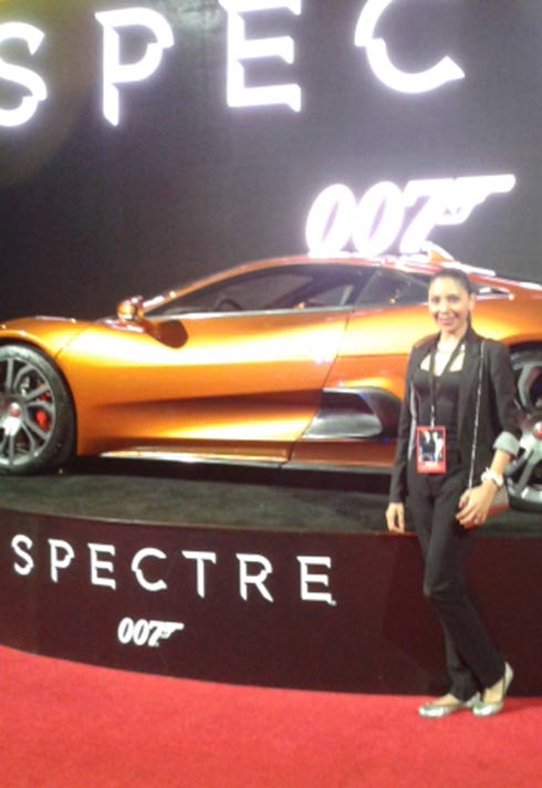 Blanche Macdonald graduate Alejandra Hernandez standing in front of car at the 007 Spectre premiere