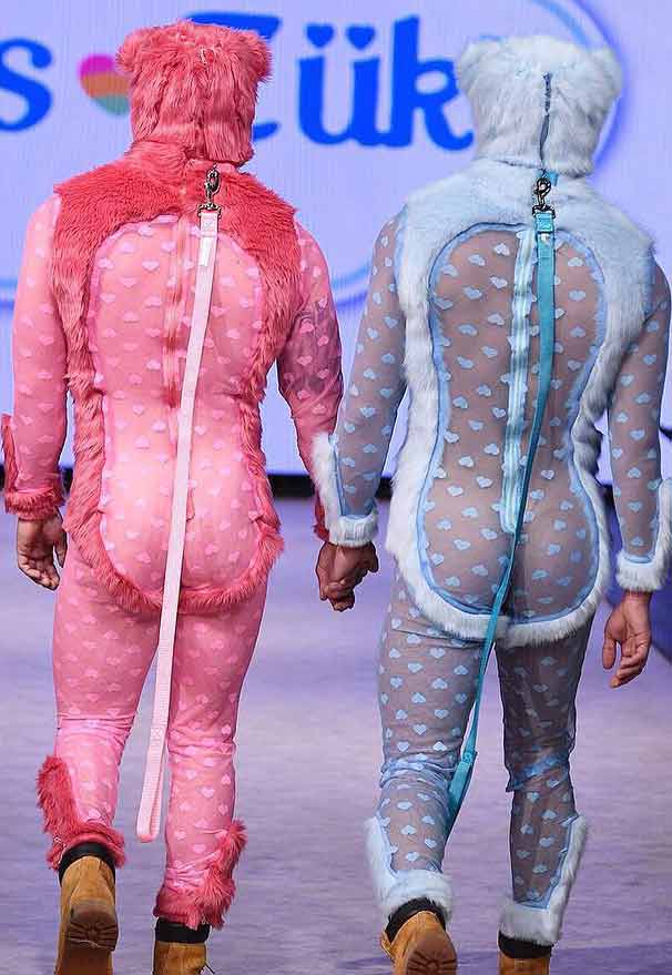 models walking hand in hand at NYFW wearing Peter Zuk designs