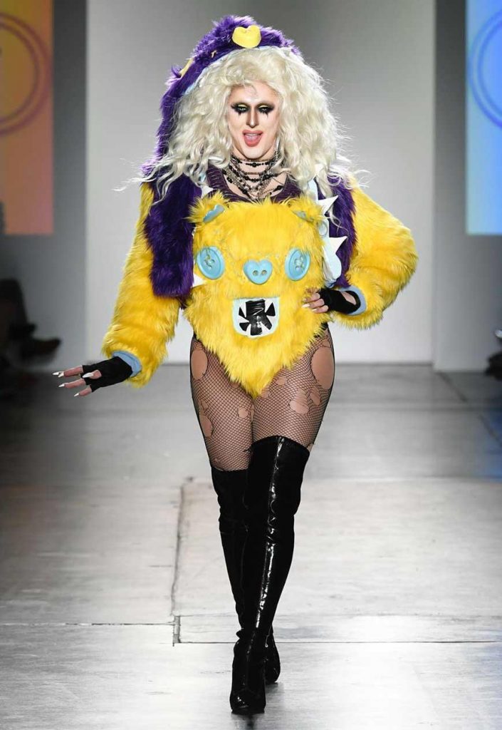 drag queen model at NYFW wearing yellow faux fur look by Haus of Zuk