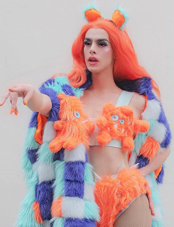 ingenue model at NYFW wearing orange white and blue faux fur outfit by Haus of Zuk