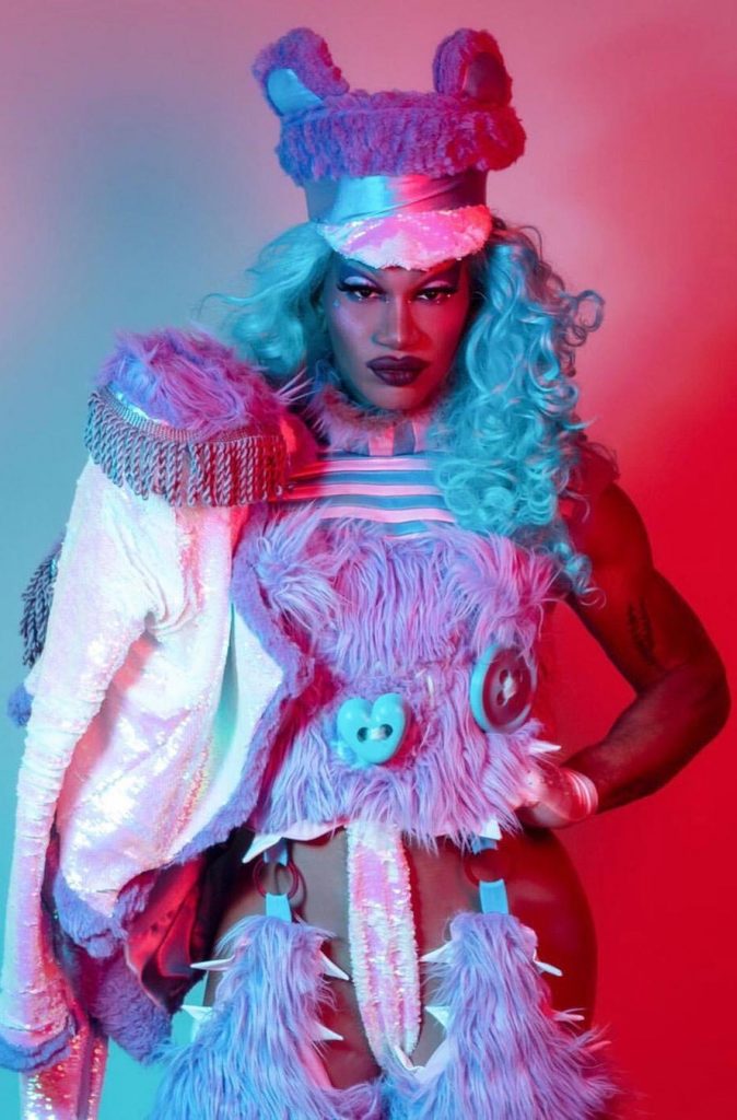 drag queen wearing faux fur and epaulettes for editorial by peter zuk