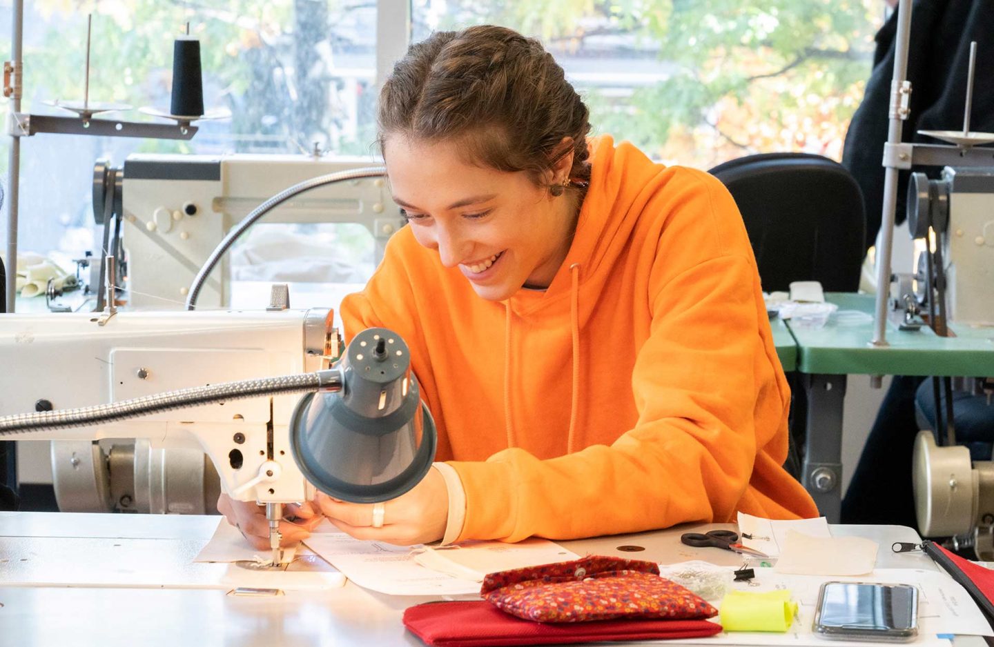 fashion design student sewing at Blanche Macdonald's Robson campus