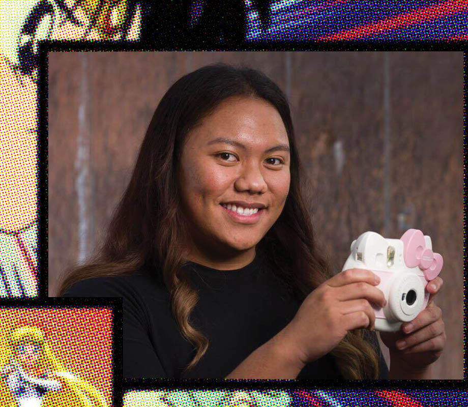 BMC Pro Hair grad Jashper Paras holding a hello kitty camera at B-bombshell Salon