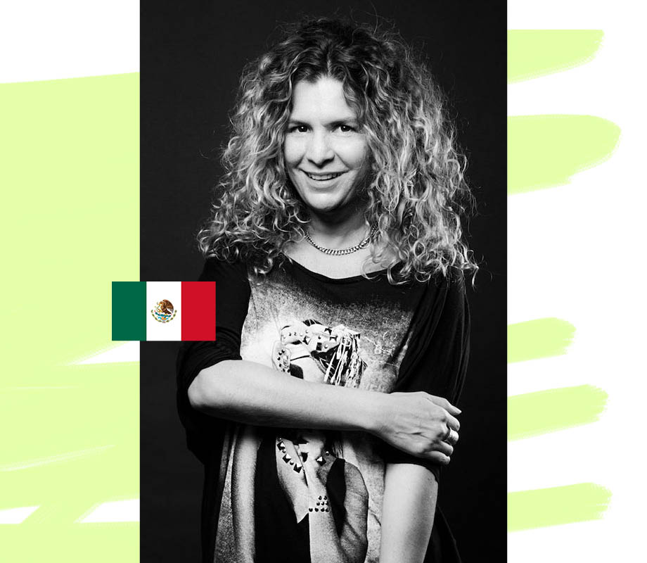 BMC Pro Makeup Graduate Gabriela Benito posing in black and white pic with Mexican Flag