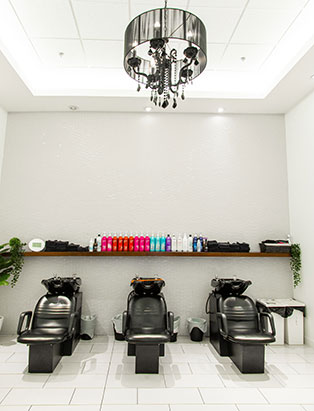 hair washing stations in bright salon