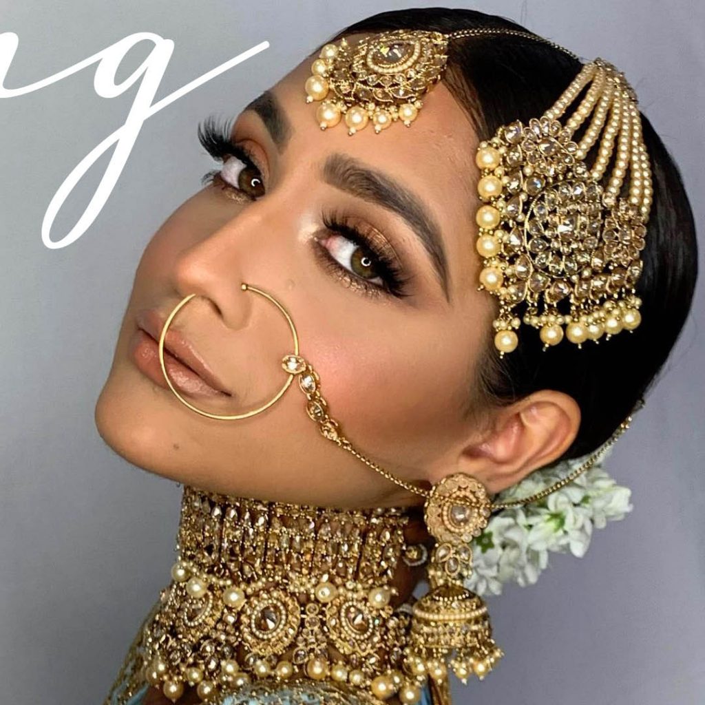 bride with copper eyeshadow look by Southeast Asian bridal specialist Sukhi Lidher