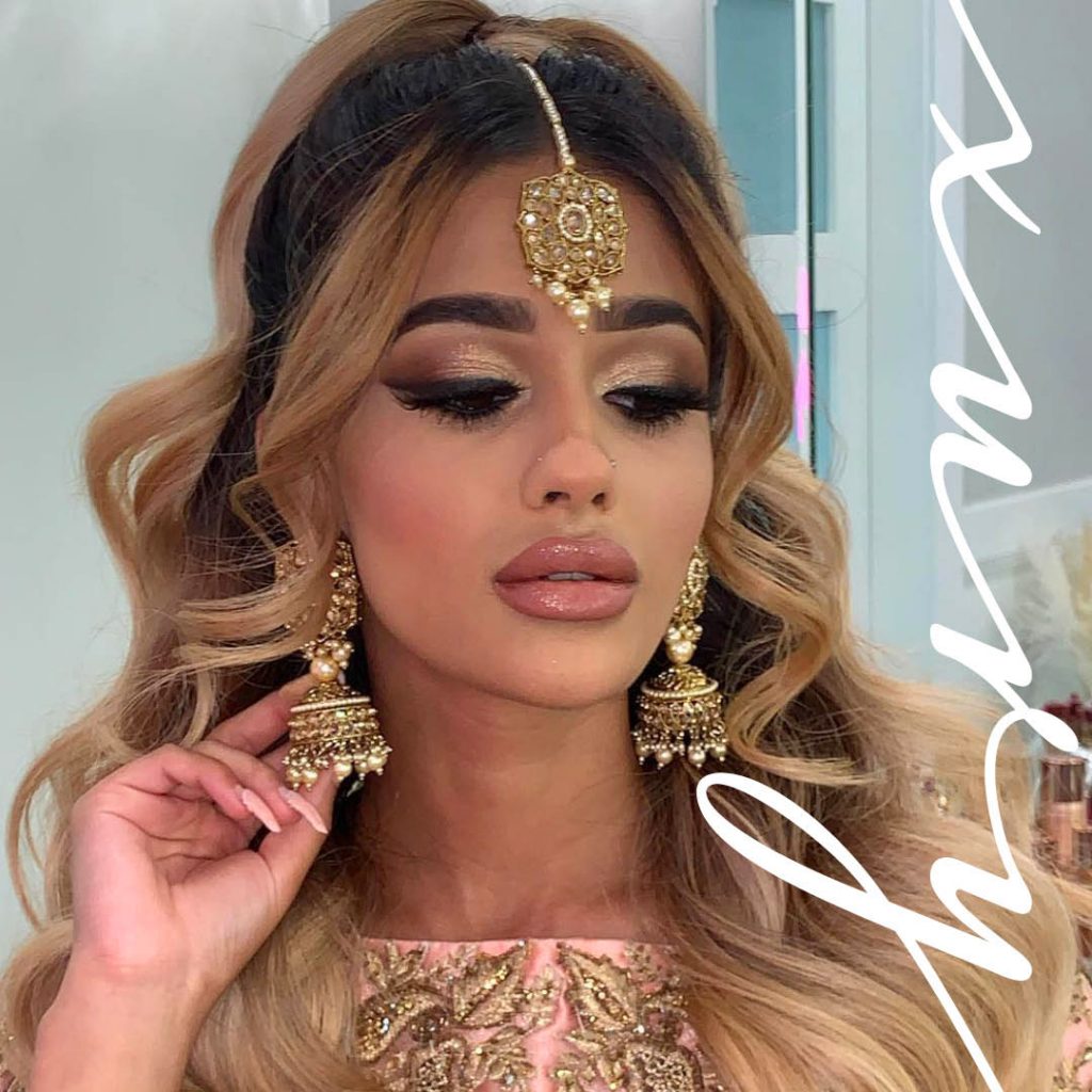 gold eyeshadow and feathery lashes Southeast Asian wedding look by BMC pro makeup graduate Sukhi Lidher