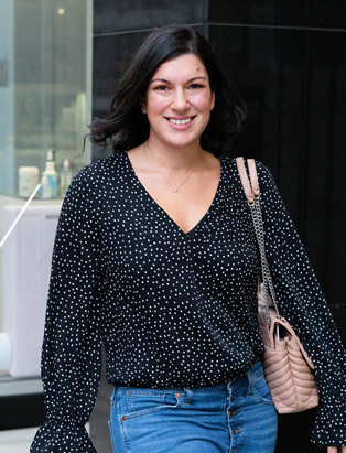 Blanche Macdonald Centre Graduate and Instructor Nikki Dindo walking down the street in Vancouver