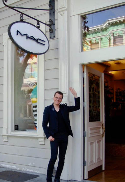 David Penrice points to MAC sign at MAC store in New Yorl