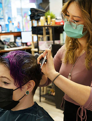 Kimiko Watanabe cuts hair at B-bombshell Salon