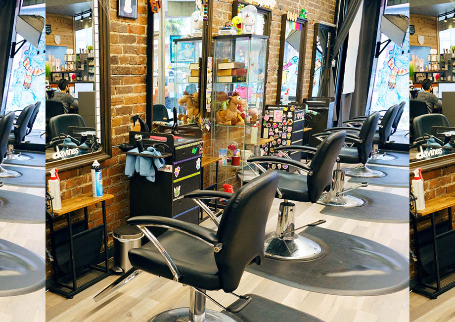 Vibrantly decorated hair salon, B-bombshell, Toy Story plushies, action figures, video-game chic