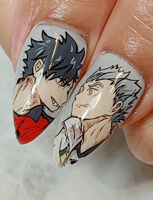 Two Anime Characters on stiletto shaped thumb nails