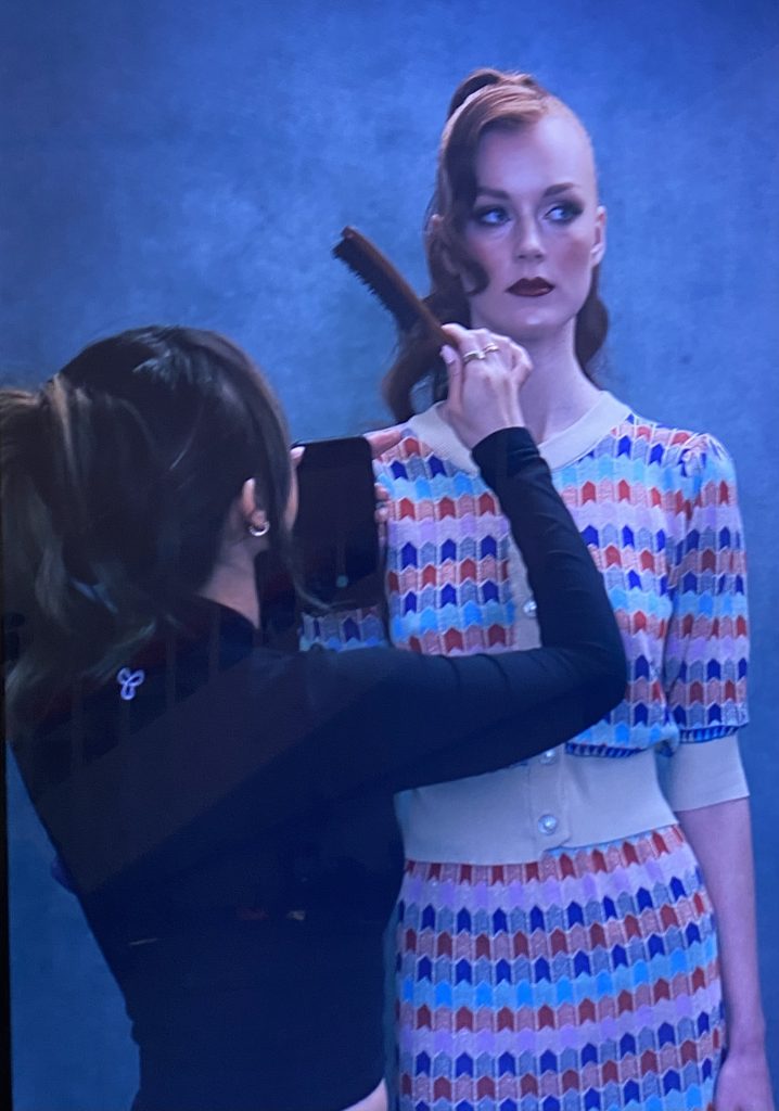 Melfinna Tjugito works on model behind the scenes