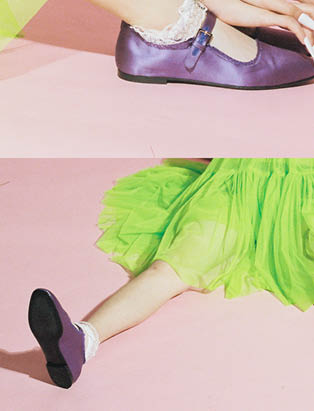Close up shot of details from the Alex S. Yu Collection, ballet flats, green tulle dress