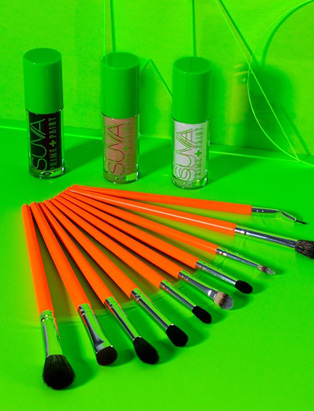 Suva Beauty's products, Prime +Paint, Essential Eye Set brushes, in a green background.