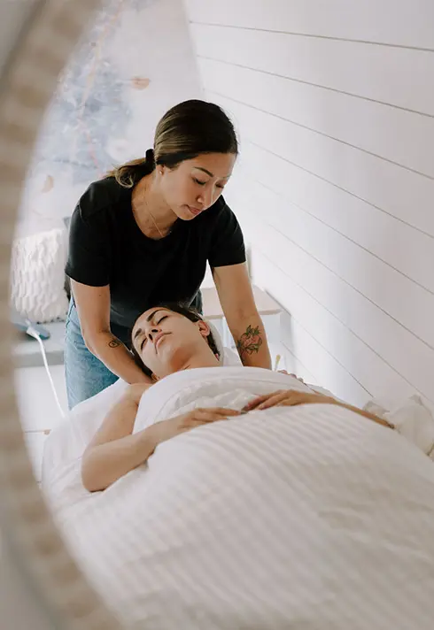 medical esthetician Gwen de la Costa performing a massage on a client